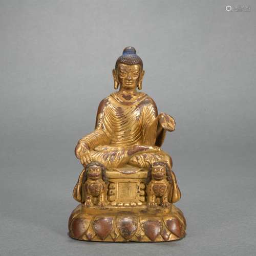 A gilt-bronze statue of Master Buddha