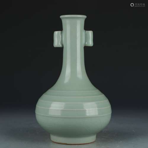 A celadon-glazed vase