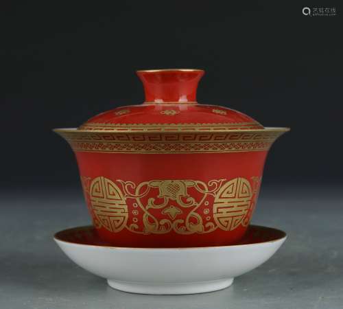 An allite red glazed bowl and cover painting in gold