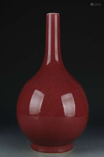 A red glazed vase