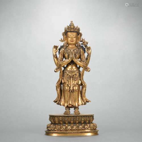 A gilt-bronze statue of Four arm Avalokitesvara