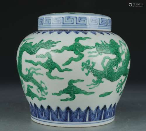 A green glazed 'dragon' jar and cover