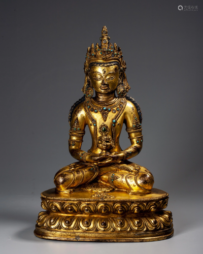 A Gilt-bronze and Inlaid Gems Sakyamuni Seated Statue