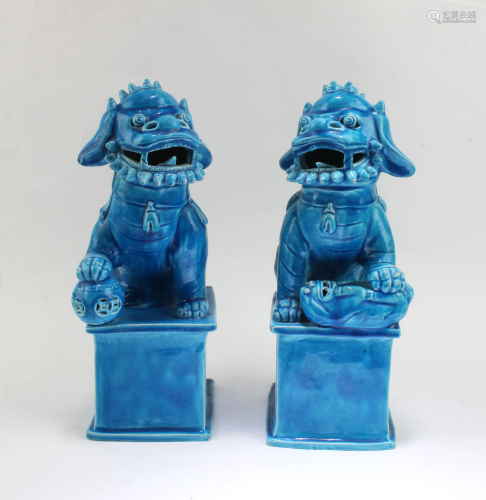 A pair of blue glass snow lions