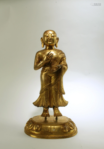A Bronze Standing Monk Statue