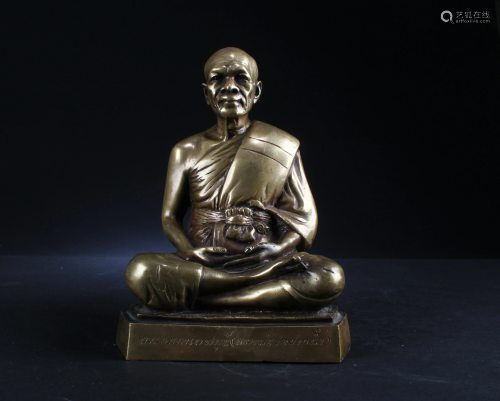 A Bronze Seated Monk Statue