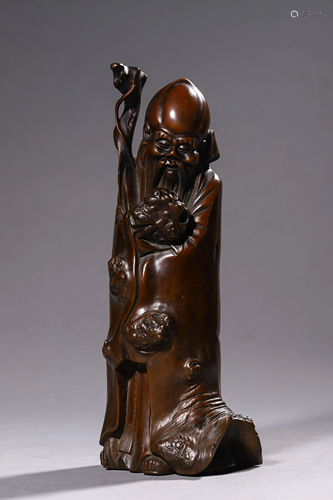 A Carved Wooden Longevity Immortal Statue