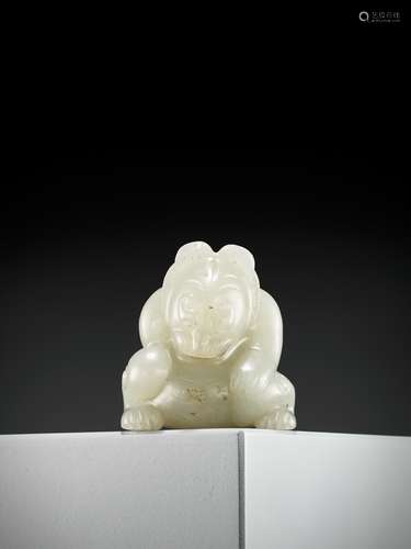 A PALE CELADON JADE FIGURE OF A BEAR, EASTERN HAN