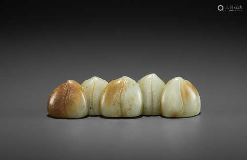 A 'FIVE PEACHES' JADE BRUSH REST, MING DYNASTY