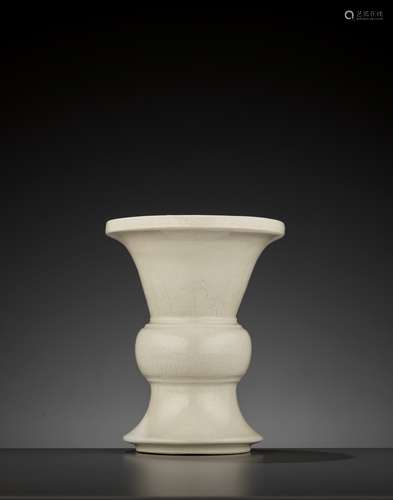 A SOFT-PASTE ANHUA-INCISED BEAKER VASE, GU, QING