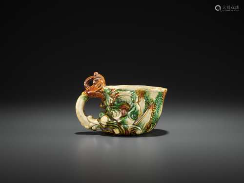 A SANCAI-GLAZED POTTERY RHYTON, TANG DYNASTY