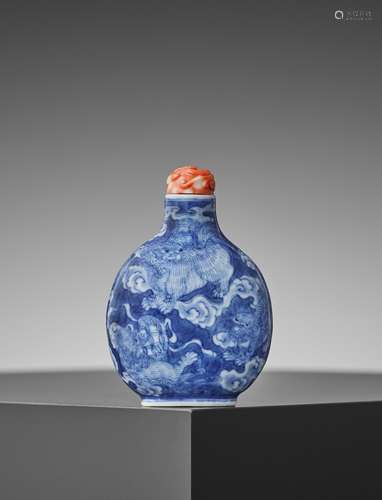 A 'BUDDHIST LIONS' PORCELAIN SNUFF BOTTLE, QING