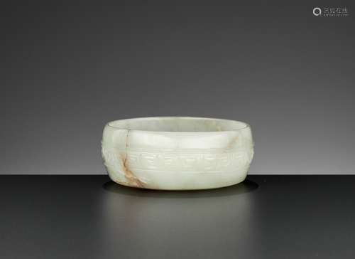 A PALE YELLOW AND CELADON JADE WASHER, MING