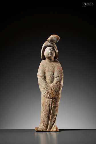 A PAINTED POTTERY FIGURE OF A COURT LADY, TANG