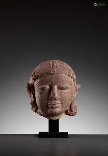 A JAIN PINK SANDSTONE HEAD OF A JINA