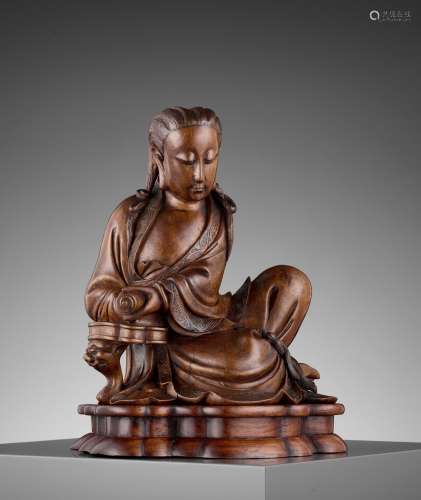 A LACQUERED HARDWOOD FIGURE OF GUANYIN, QING