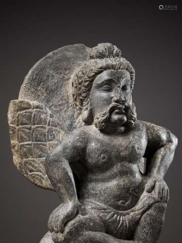 A GRAY SCHIST FIGURE OF A WINGED ATLAS, GANDHARA