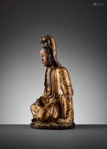 A GILT-LACQUERED WOOD FIGURE OF GUANYIN, MING