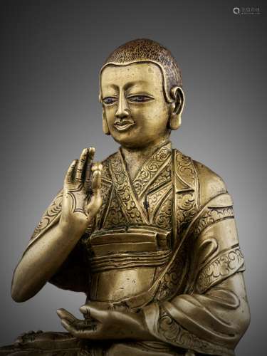 A SILVER-INLAID BRONZE FIGURE OF SONAM LHUNDRUP