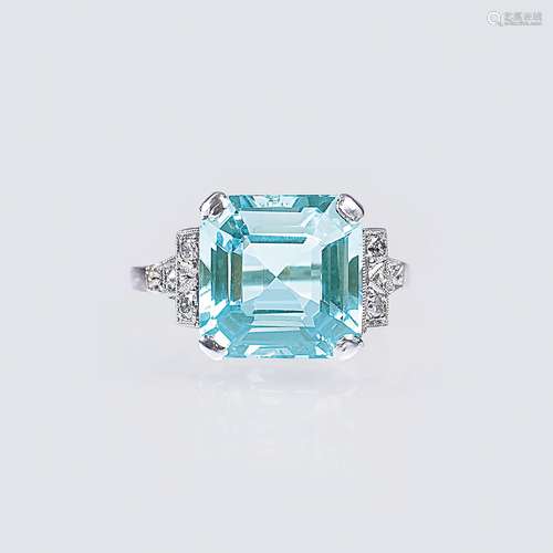 An Art-déco Aquamarine Ring with Diamonds.