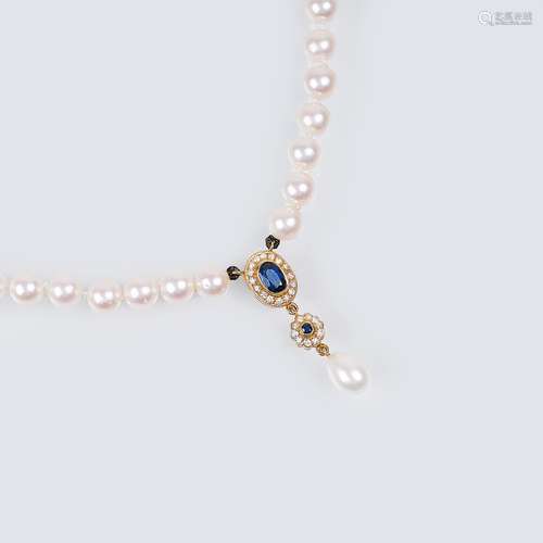 A Pearl Necklace with Sapphire Diamond Pendant.