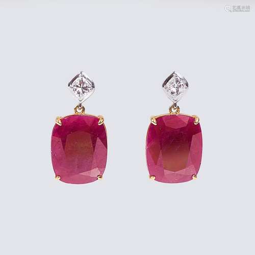 A Pair of Earrings with natural Rubies and Diamond Setting.