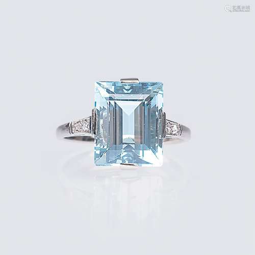 An Art-déco Aquamarine Ring with Rosecut Diamonds.