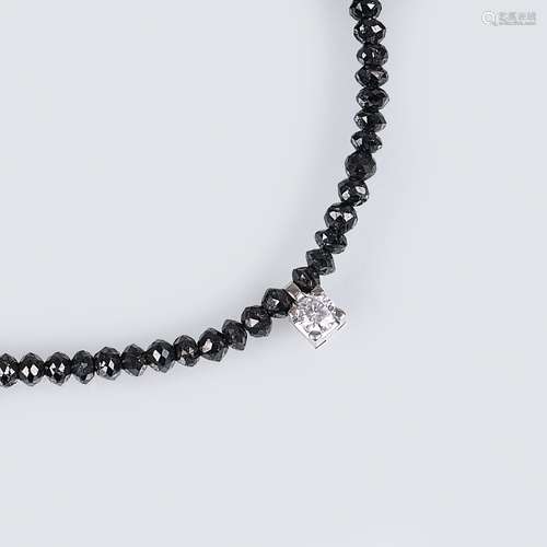 A Black Diamond Necklace with Solitaire Diamond.