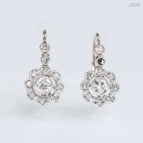 A Pair of petite Diamond Earpendants.