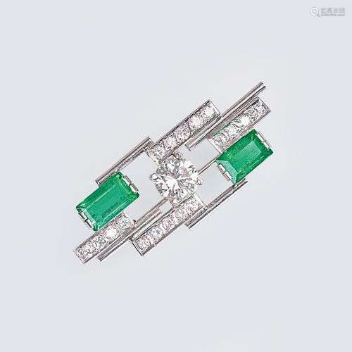 An Emerald Diamond Brooch with Solitaire.