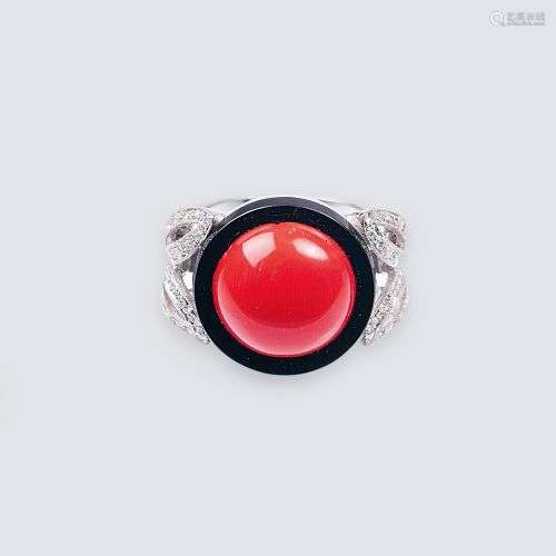 A Ring with Coral, Onyx and Diamonds.