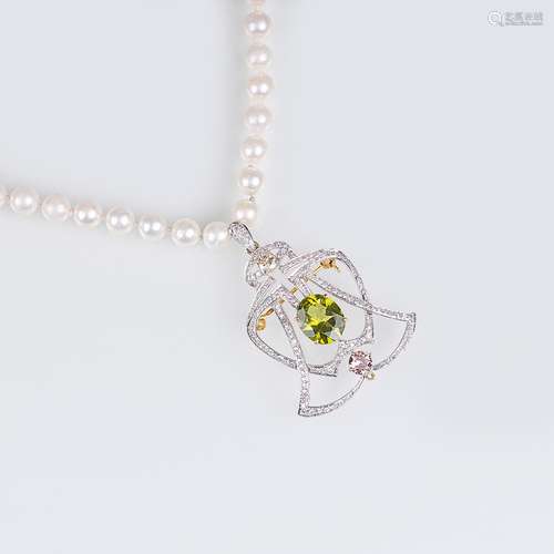 A Pearl Necklace with Peridot Pendant.