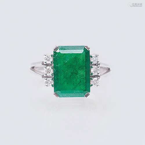 An Emerald Diamond Ring.