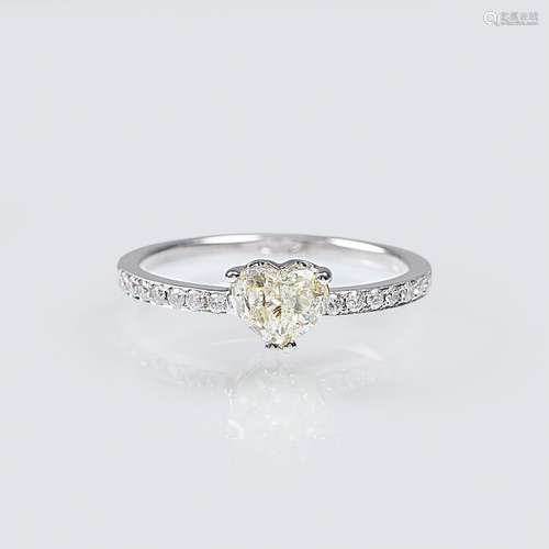 A Solitaire Ring with Heart shaped Diamond and small diamond...