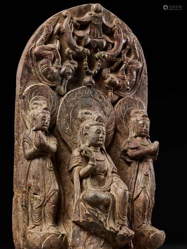 A LIMESTONE BUDDHIST TRIAD STELE OF GUANYIN