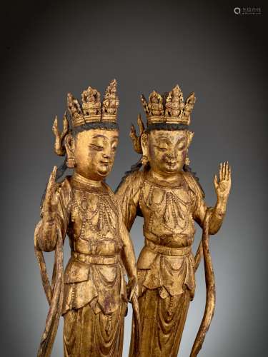 A PAIR OF EARLY GUANYIN WOOD FIGURES, 1026-1185