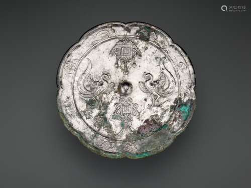 A LARGE SILVERED BRONZE MIRROR, TANG-LIAO DYNASTY