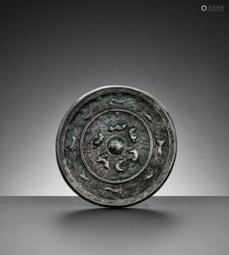 A SILVERED BRONZE 'LION' MIRROR, TANG DYNASTY