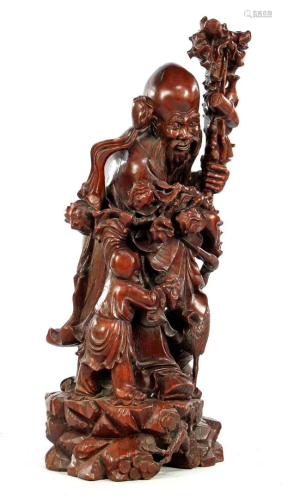 Richly carved oriental statue