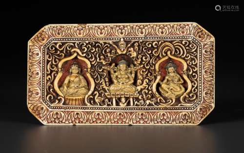 A CARVED IVORY 'BUDDHIST TRIAD' MANUSCRIPT COVER, 17TH CENTU...