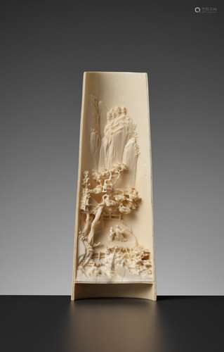 AN IVORY 'MOUNTAIN LANDSCAPE' WRIST REST, LATE QING TO REPUB...