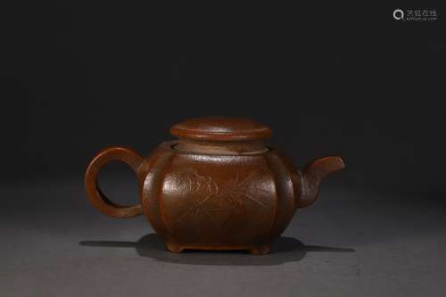 A PURPLE CLAY TEAPOT