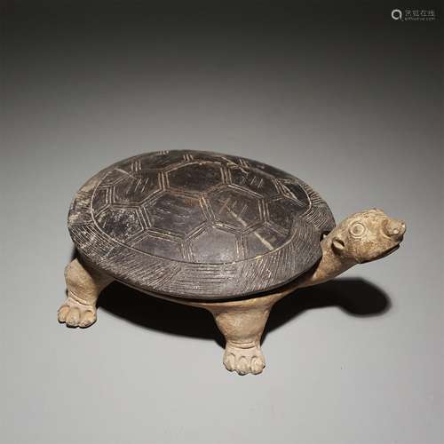 A HAN DYNASTY BLACK POTTERY TURTLE INKSTONE