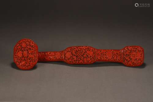 A CARVED RED LACQUERWARE EIGHT TREASURES RUYI