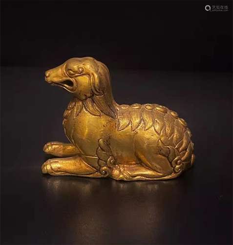 A GILT BRONZE SMALL MONSTER