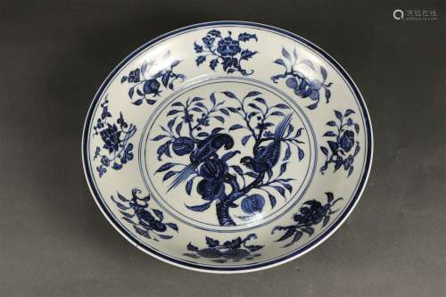 A BLUE AND WHITE FLOWER AND BIRD PLATE