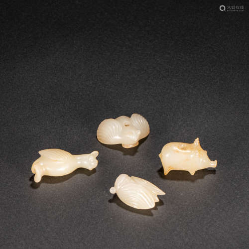 A GROUP OF CHINESE JADE ORNAMENTS, HAN DYNASTY