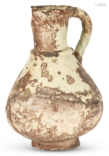 A Persian Glazed Pottery Ewer