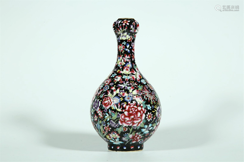 A BLACK GROUND POLYCHROME FLORAL GARLIC HEAD…