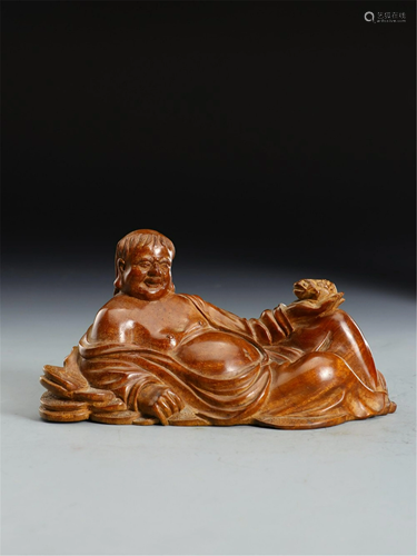 A HARDWOOD CARVED FIGURAL DECORATION